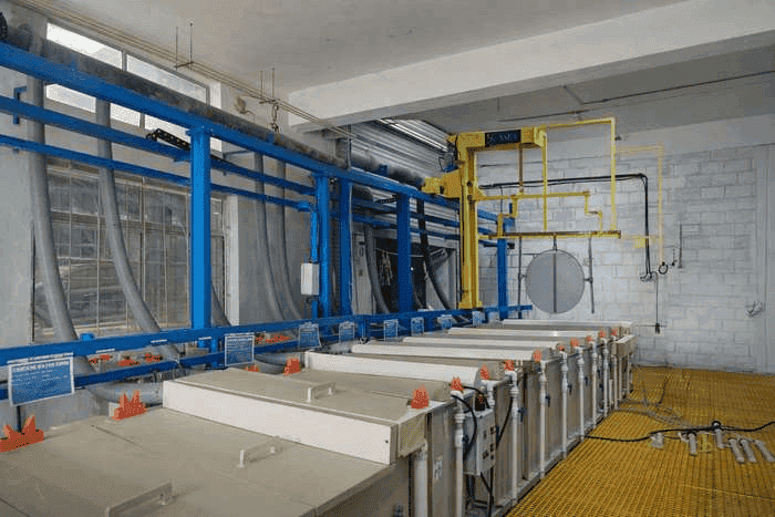 Technician performing catalyst coating on electrode at Newtrace